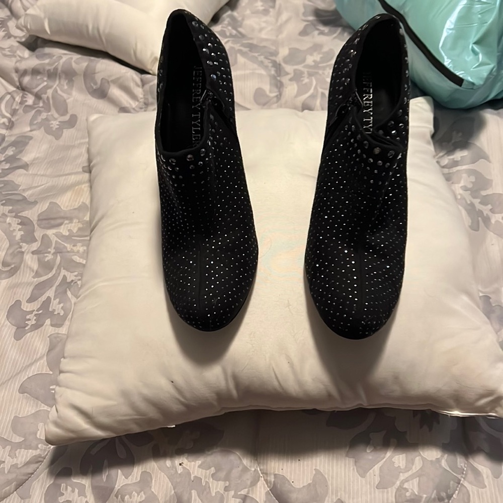 Sequined high heeled booties.